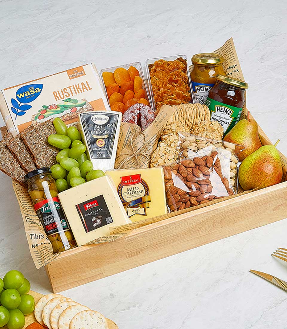 Artisan cheese and gourmet delights hamper with brie, cheddar, crackers, olives, preserves, dried fruits, nuts and wine