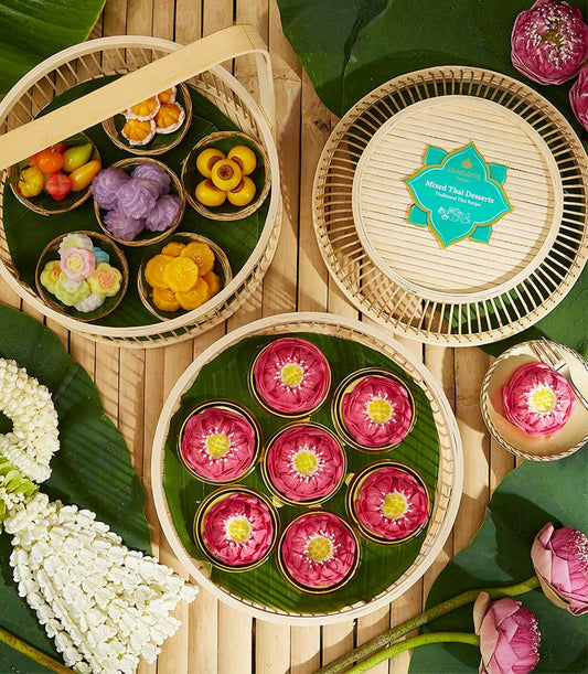 Kanom Ar-Lua traditional Thai sweets collection in woven basket with Luk Chup, lotus desserts, and banana leaf presentation