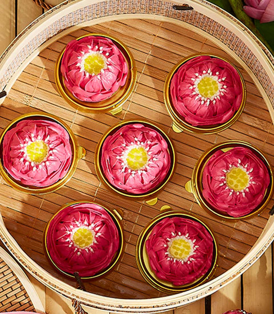 Lotus-shaped pink frosting cakes in gold containers, bamboo steamer gift set for Thai New Year