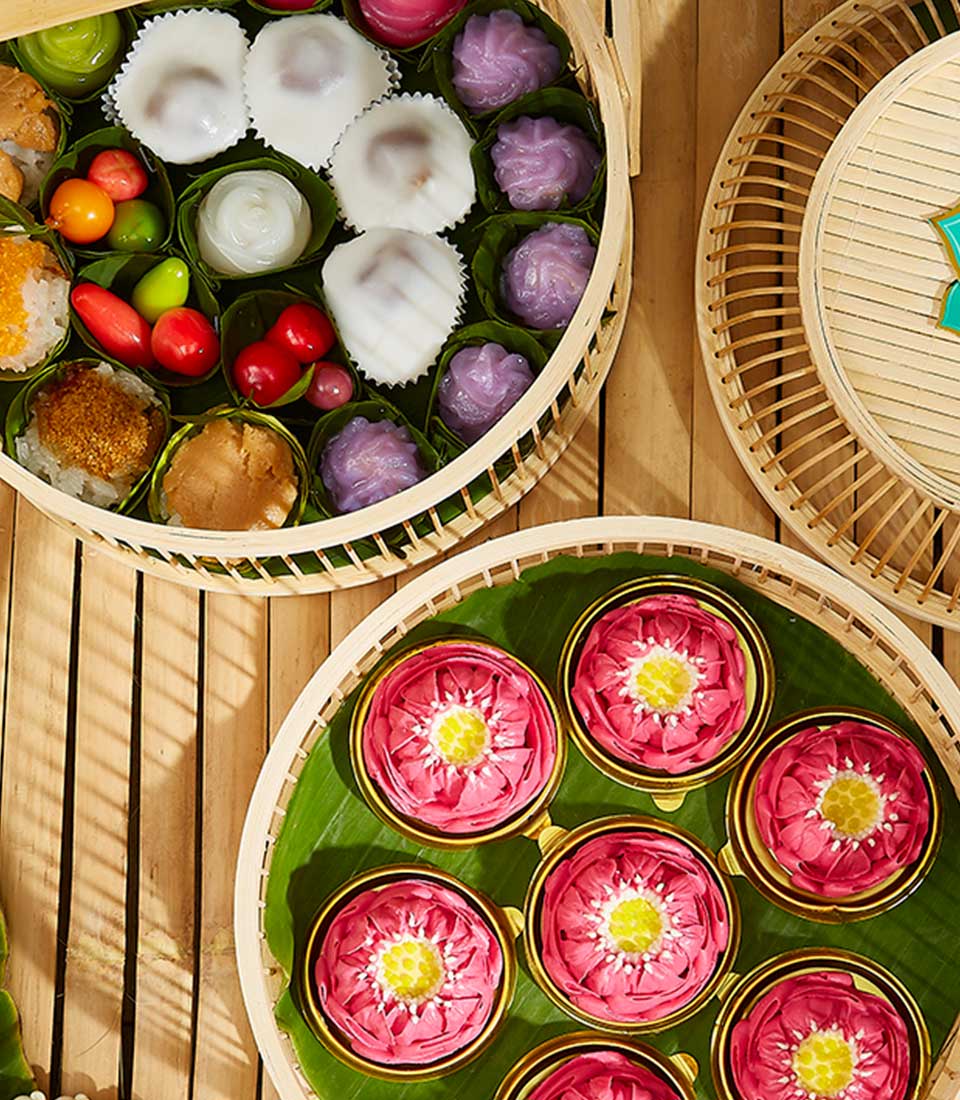 Basketeer premium hamper delivery Thailand: Woven baskets of Thai sweets including Ar-Lua lotus blossom desserts. A luxurious Bangkok gift.
