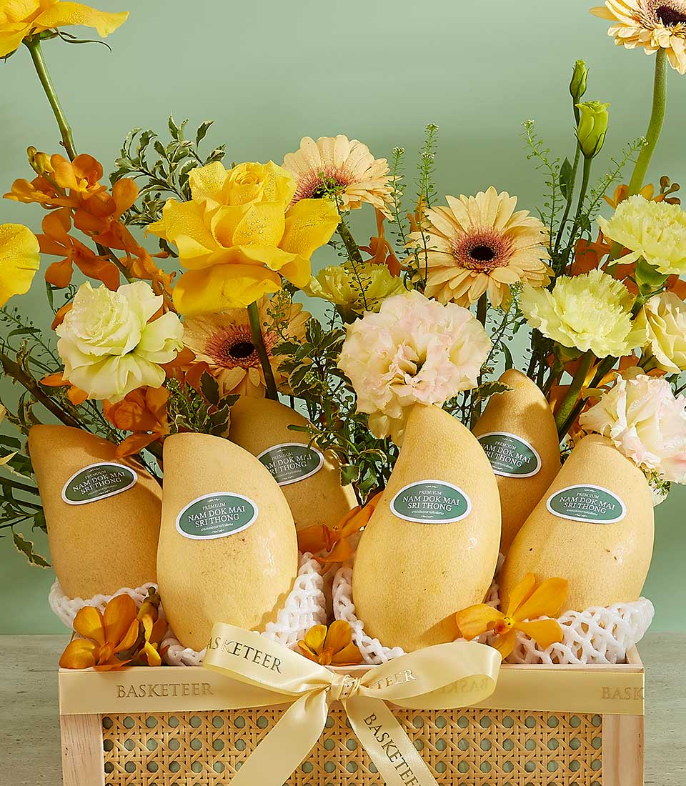 Premium Si Thong mango gift basket with yellow roses, orchids, and carnations in woven rattan