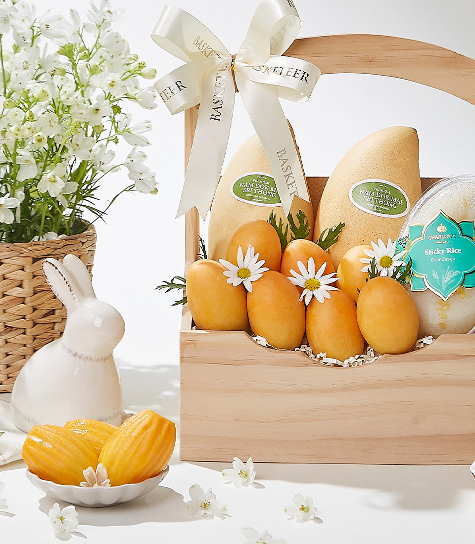Premium Nam Dok Mai mangoes and sticky rice gourmet gift basket with artisan madeleines and fresh flowers