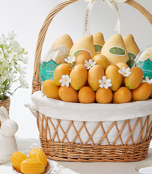 Premium mango gift basket with tropical fruits, sticky rice, and artisan treats in wicker presentation