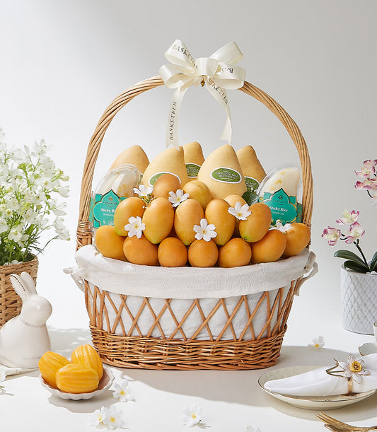 Luxury mango gift basket with tropical fruits, sticky rice, and white ribbon bow