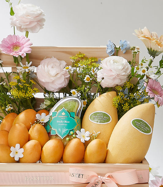 Premium Thai mango and fresh flower gift crate with pink ranunculus and gerbera daisies