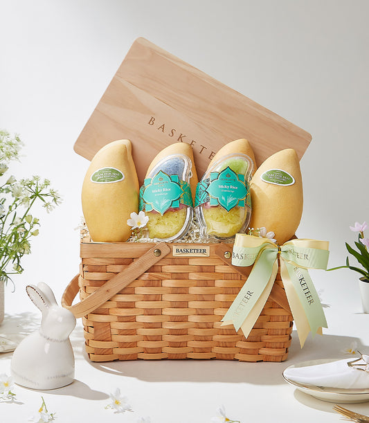 Golden tropical fruit and sticky rice gift basket with woven wood handle and teal ribbon