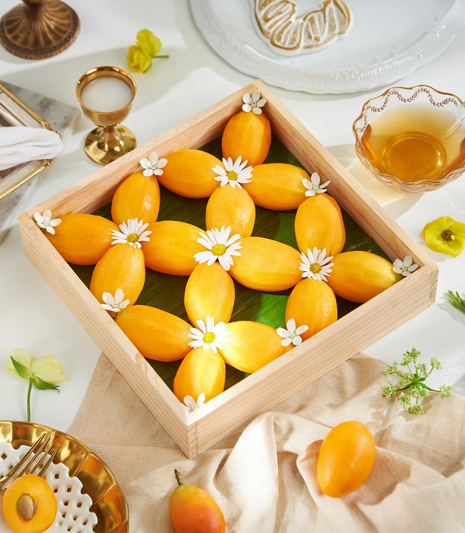 Premium peeled Mayongchid flowers with white daisy blooms in wooden tray, artisan gift add-on