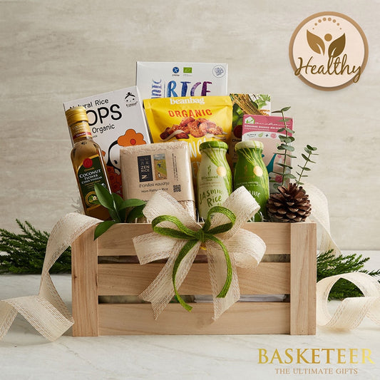 Wholesome Living gift basket with organic rice, coconut vinegar, and wellness essentials in wooden crate