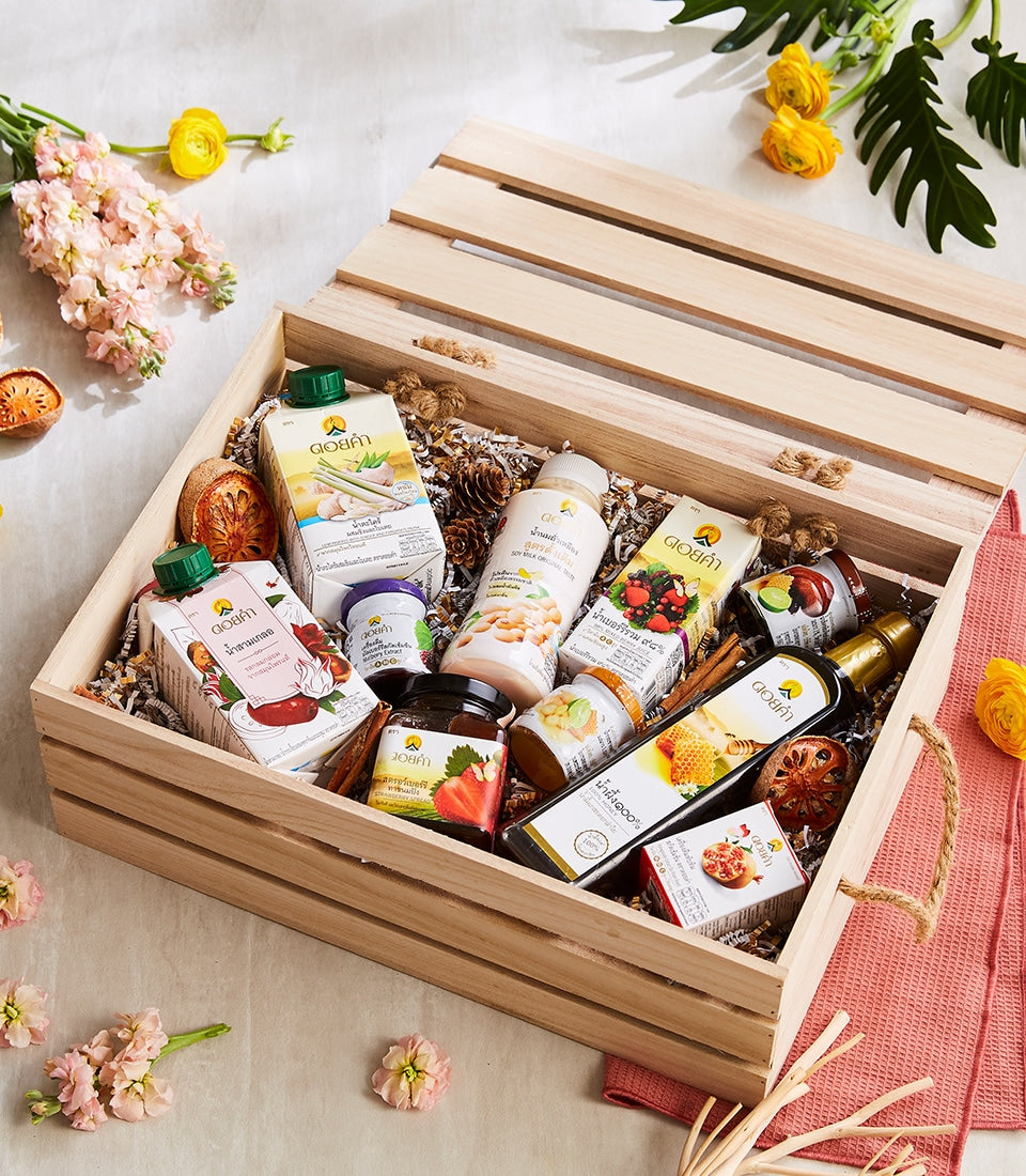 Doi Kham wooden gift crate with Thai beverages, jams, and preserves in natural packaging