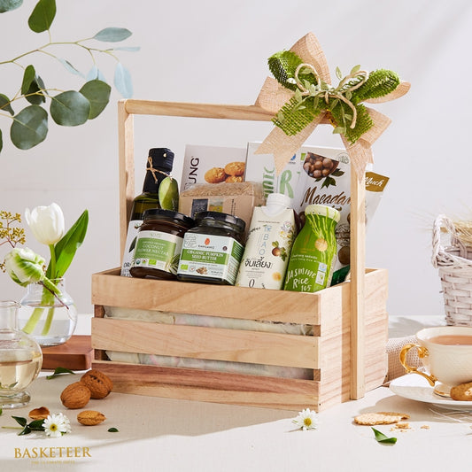 Thai organic gift basket with olive oil, coconut nectar, nuts, and natural burlap bow