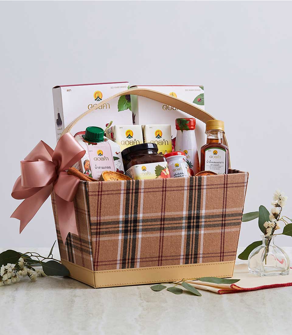 Luxury gift basket with plaid fabric, gourmet Thai treats, and dusty rose ribbon bow