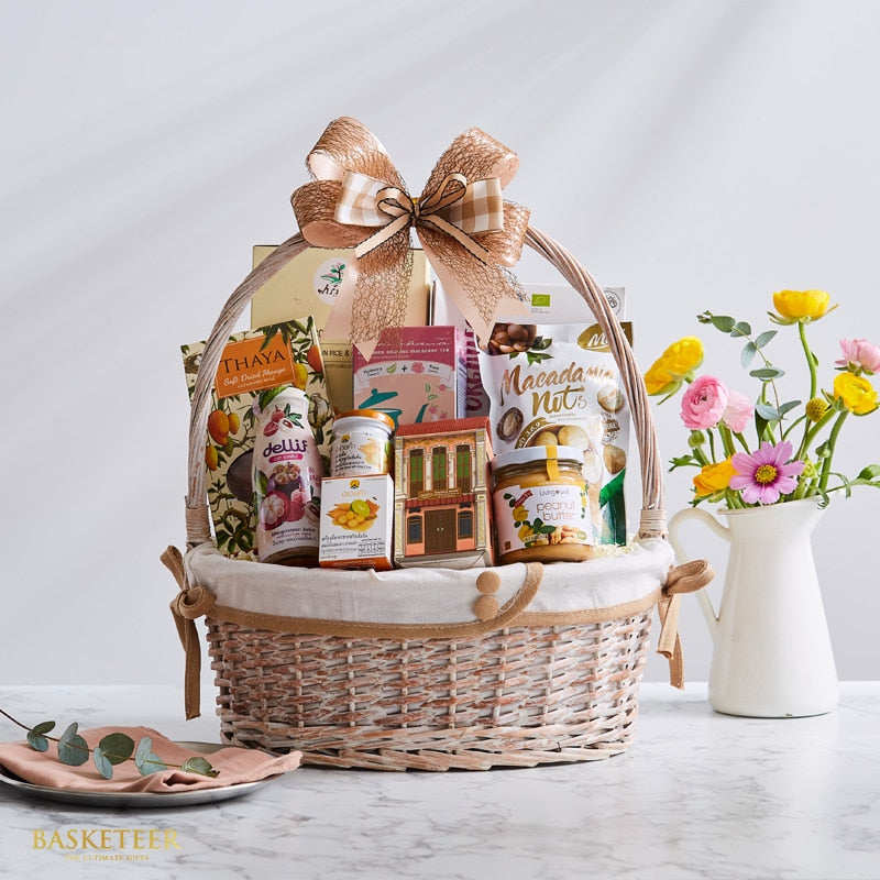Premium Thai gourmet gift basket with dried mango, macadamia nuts, and artisan treats in woven wicker