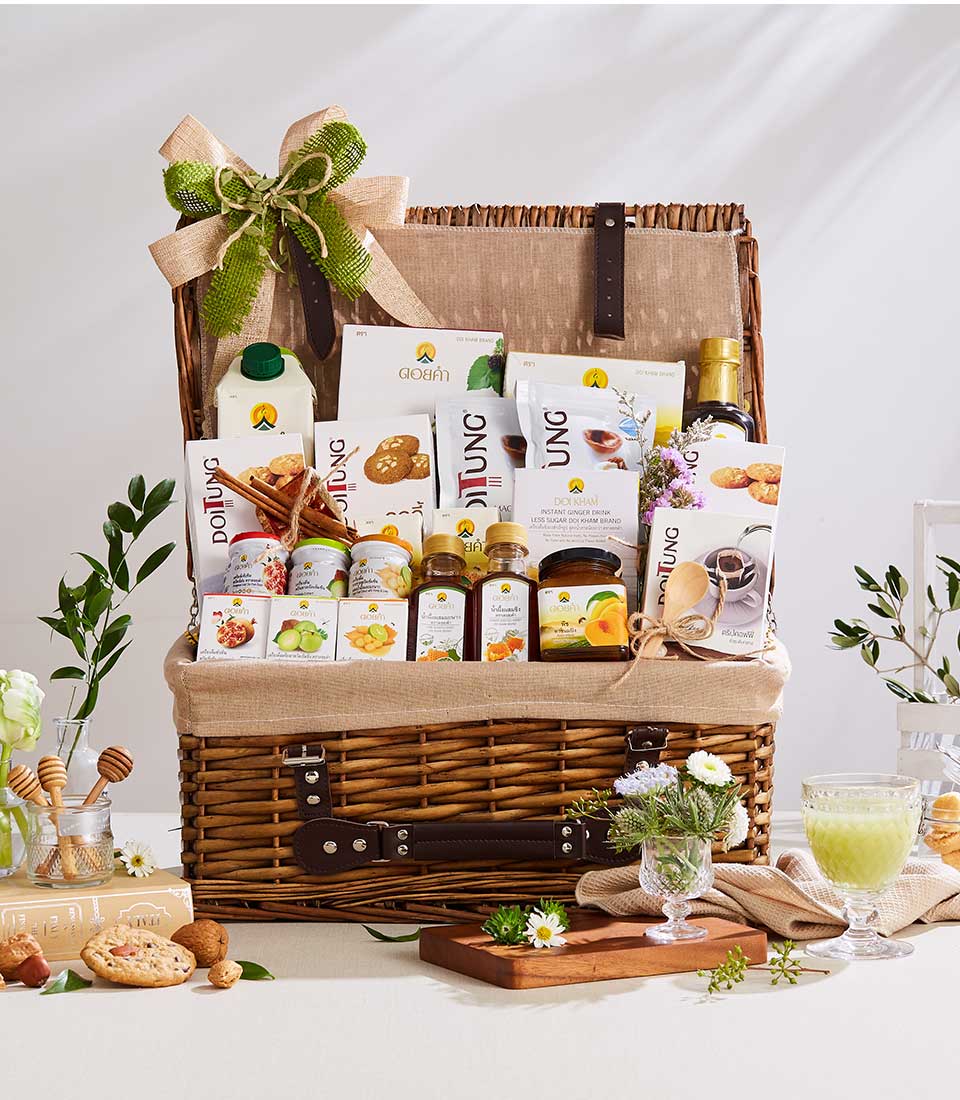 Premium Doi Tung and Doi Kham wicker picnic basket with gourmet wellness treats, artisan preserves, and organic beverages