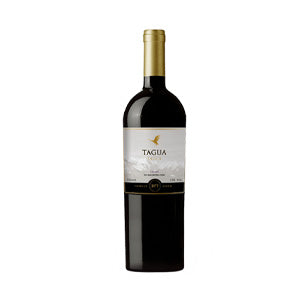 Premium red wine with gold foil capsule and mountain label, festive gift presentation