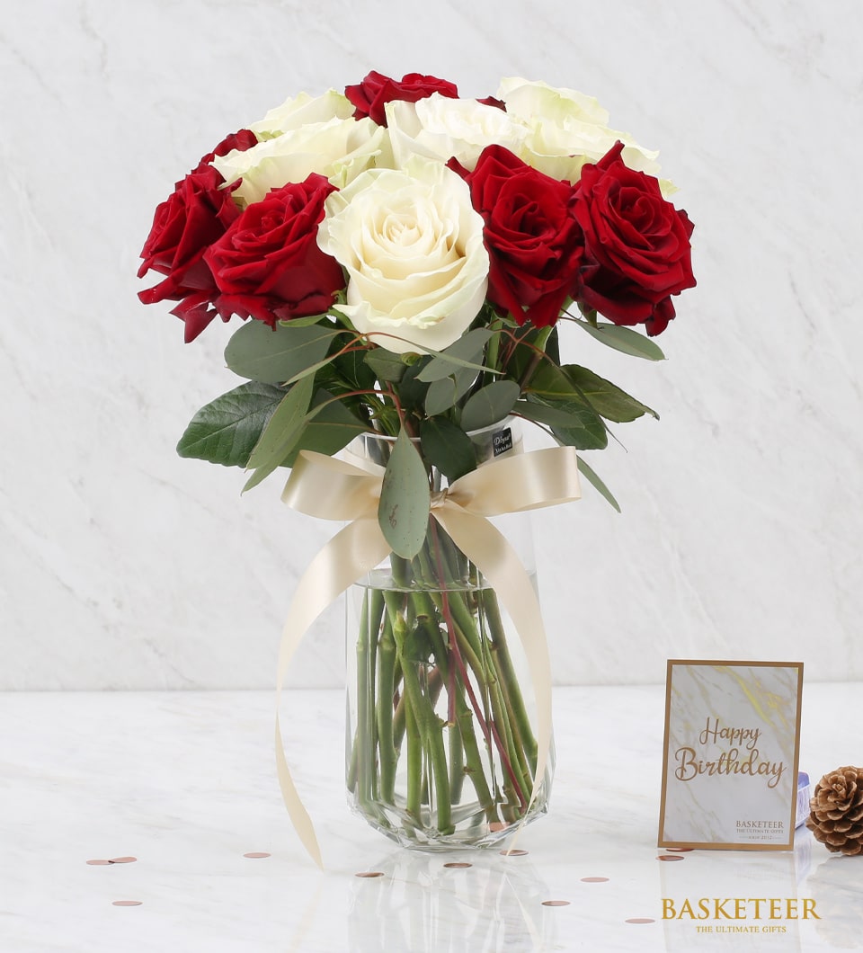 Red and white roses in glass vase with gold ribbon, premium fresh flower arrangement for gifting