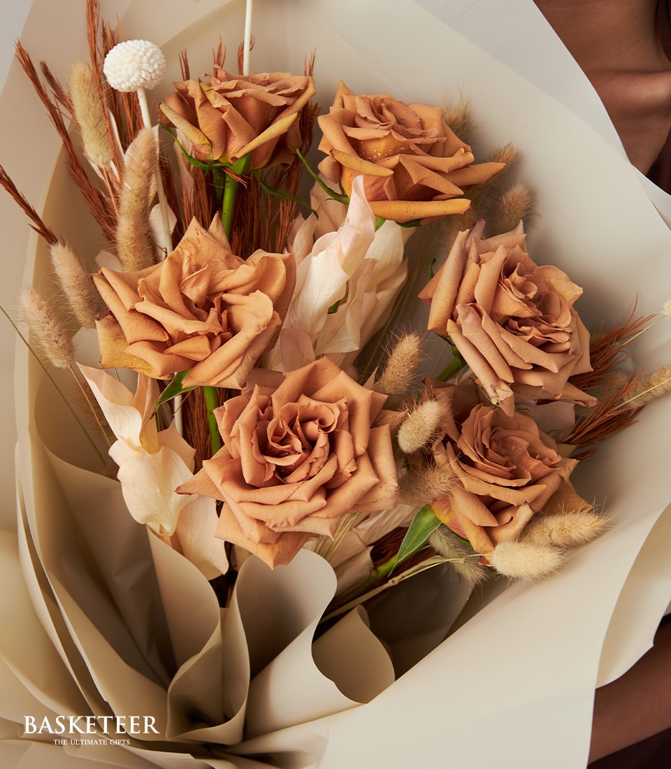 Rustic terracotta rose bouquet with dried pampas grass and cream paper wrap for Valentine's Day