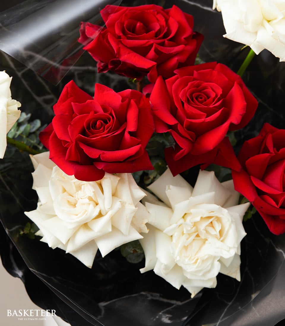 Elegant red and white rose bouquet wrapped in black marble-patterned paper, premium fresh flowers for anniversaries