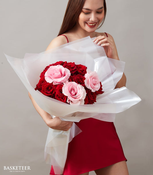 Red and pink rose bouquet with white wrapping, romantic anniversary gift for her