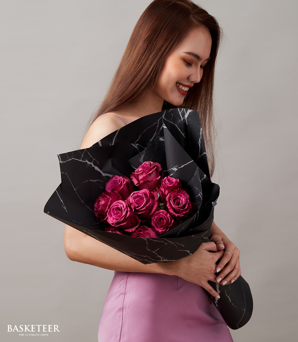 Deep pink Ecuador roses bouquet with black marble wrapping, perfect for anniversaries and romantic occasions