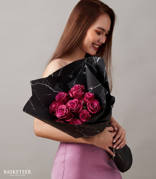 Deep pink Ecuador roses bouquet with black marble wrapping, perfect for anniversaries and romantic occasions