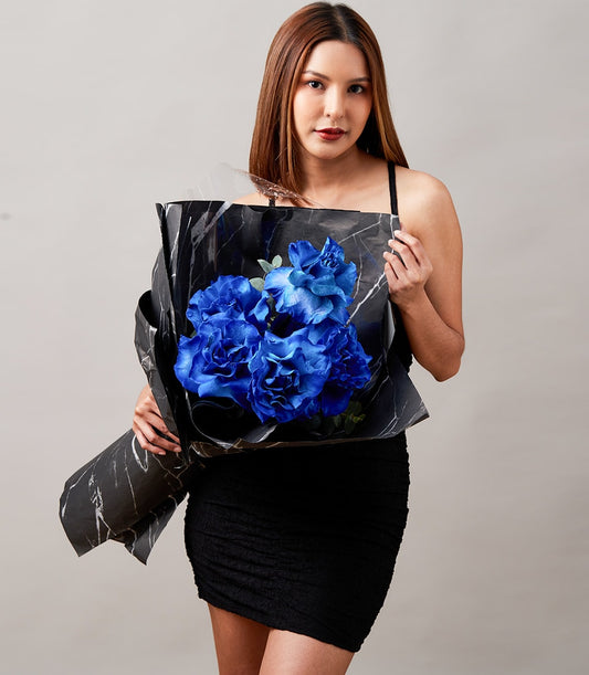 Royal blue rose bouquet with black marble wrapping for Valentine's Day gifts