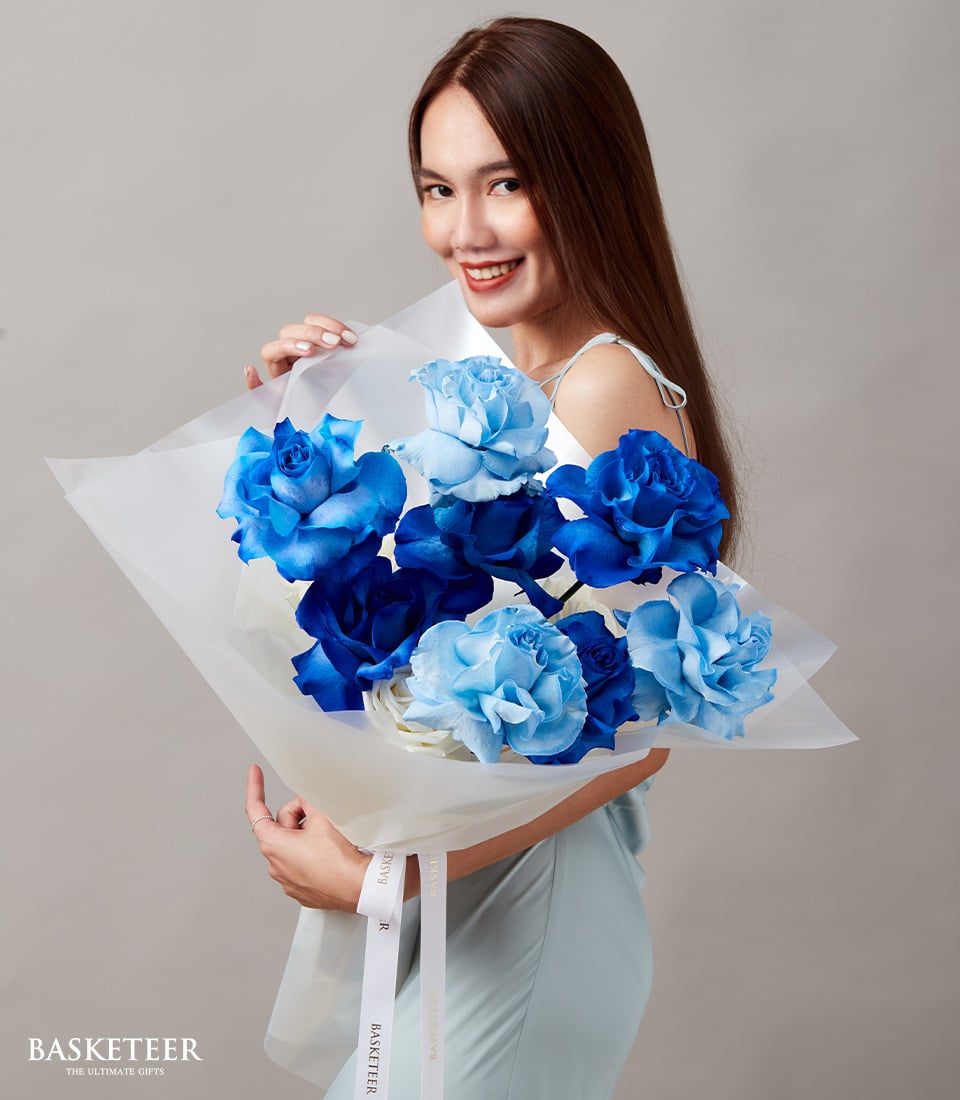 Elegant blue and white roses bouquet wrapped in white paper, perfect Valentine's Day gift for him or her