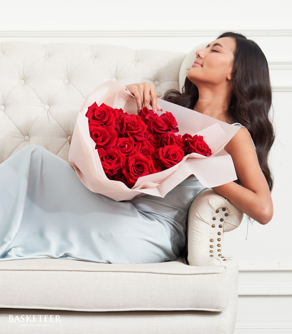 Red rose bouquet in blush paper, romantic gift for her anniversary