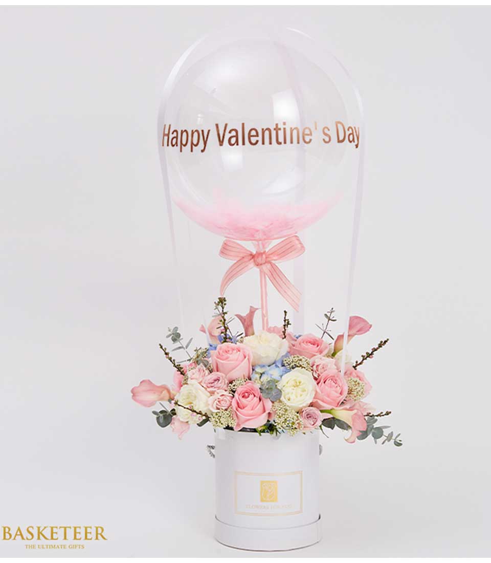 Pink and white roses with hydrangeas in white box, topped with Happy Valentine's Day balloon