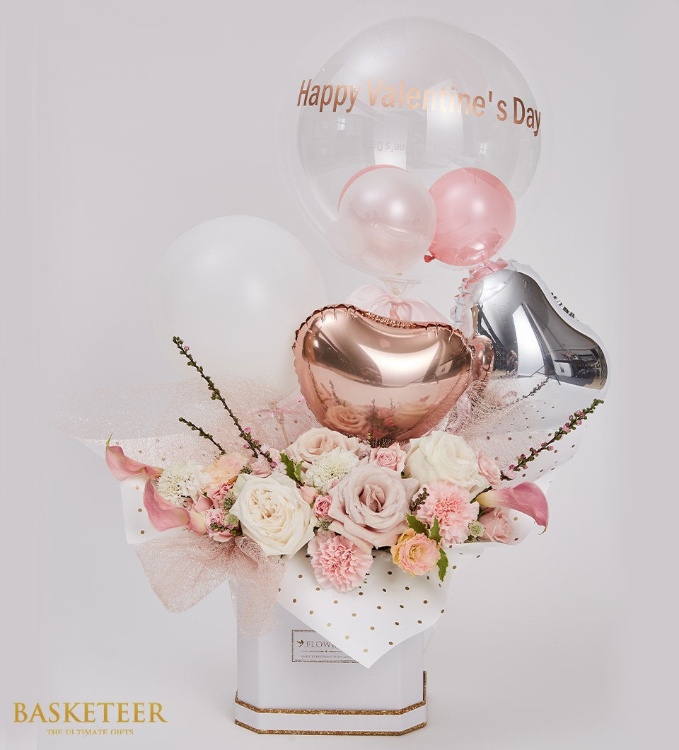 Luxe Valentine's flower box with white roses, carnations, and calla lilies, paired with gold-accented balloon bouquet