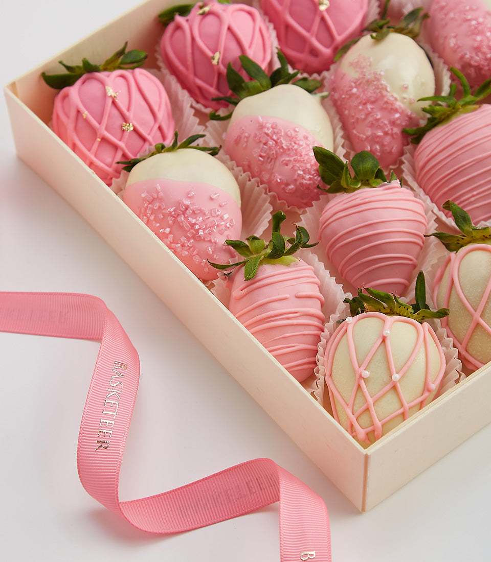 Deluxe chocolate-covered strawberries in pink and white coatings with gold leaf, Valentine's gift box
