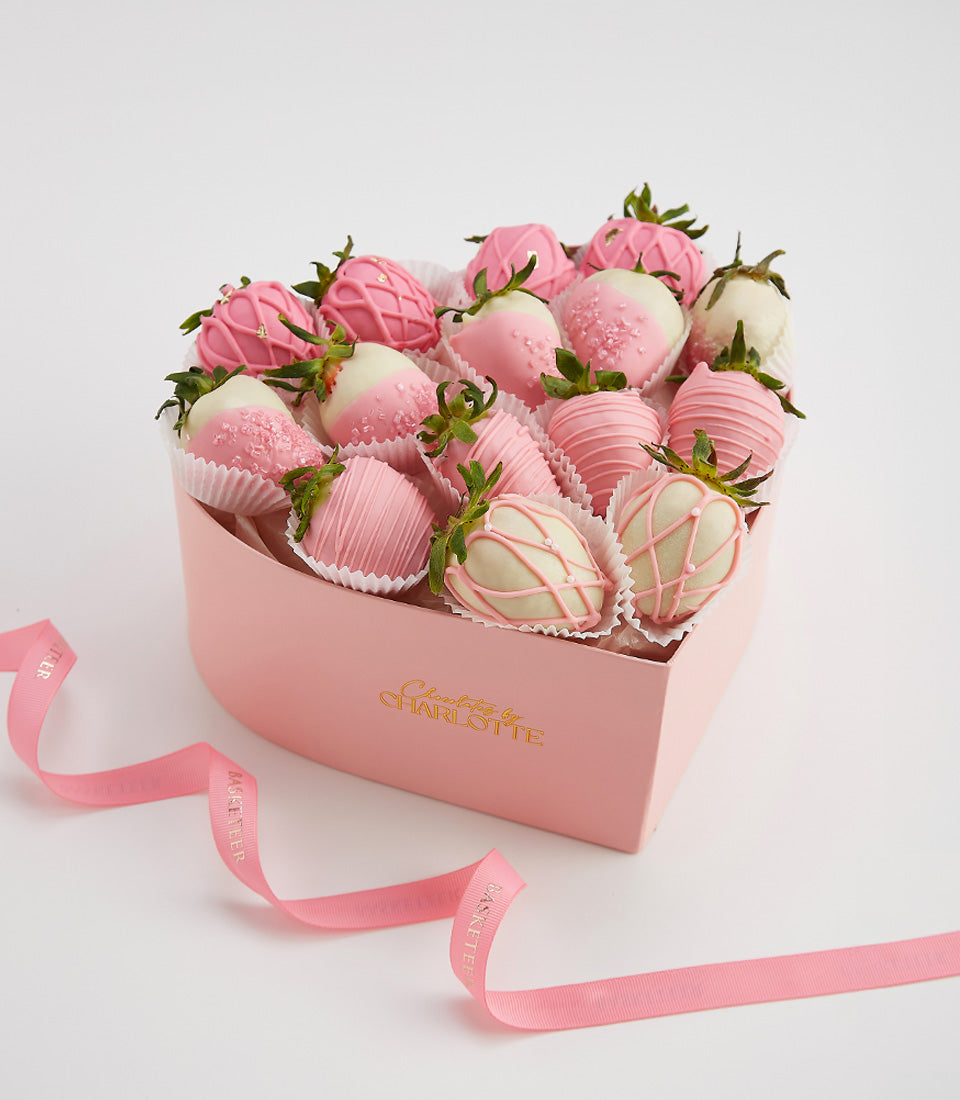 Heart-shaped pink box of chocolate-covered strawberries with gold leaf accents, Valentine's Day gift hamper