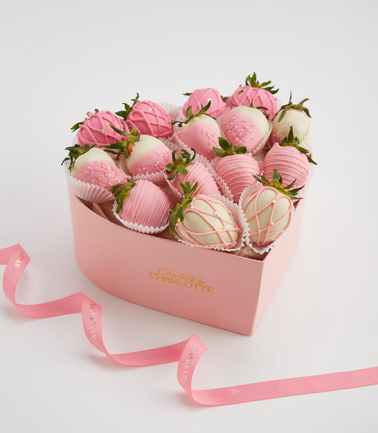 Heart-shaped pink box of chocolate-covered strawberries with gold leaf accents, Valentine's Day gift hamper