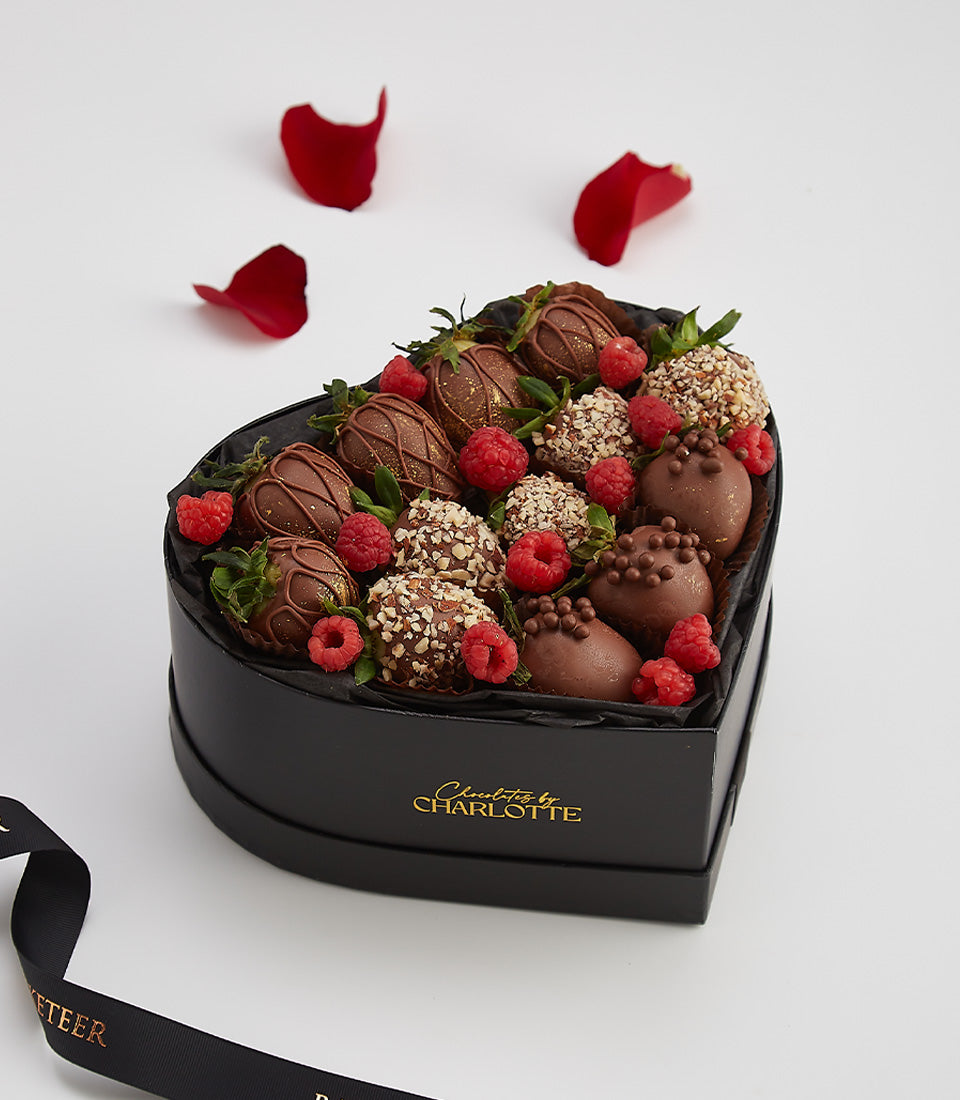 Dark chocolate-covered strawberries and raspberries in heart-shaped box, Valentine's Day gift