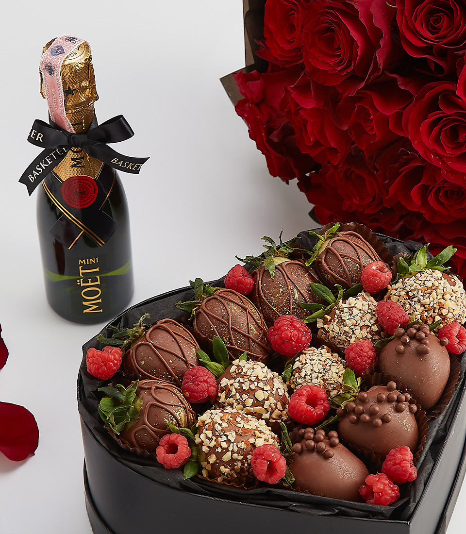 Moët champagne, red roses, and dark chocolate strawberries in heart-shaped box for Valentine's Day