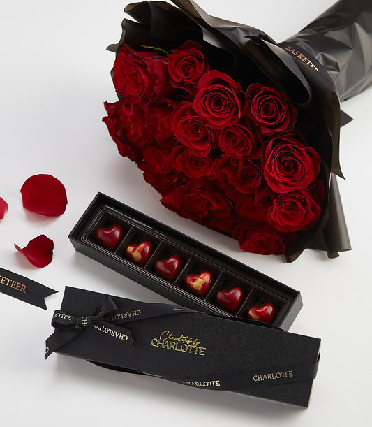 Red roses with luxury heart-shaped chocolates Valentine's gift set, elegant black packaging with gold details