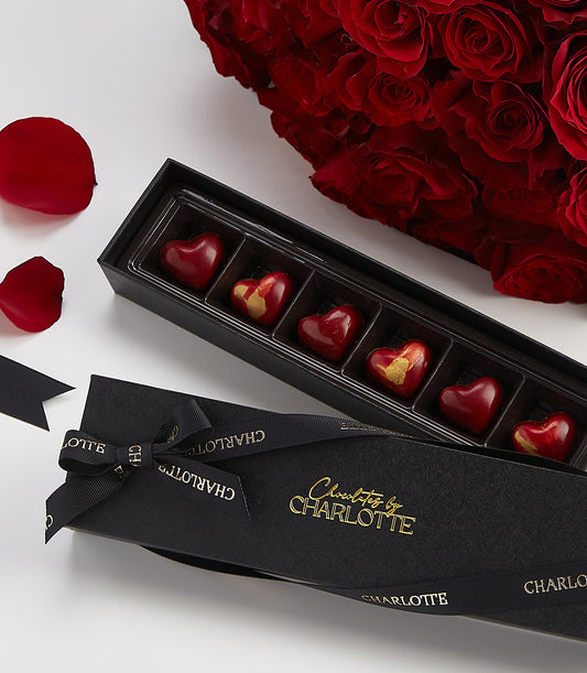Luxury heart-shaped chocolates and premium red roses Valentine's gift set with black ribbon