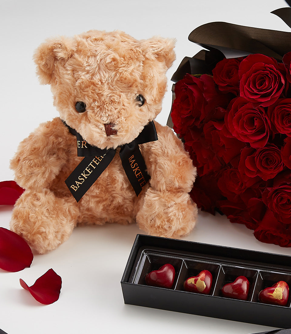 Red roses and teddy bear Valentine's Day gift set with heart-shaped chocolates
