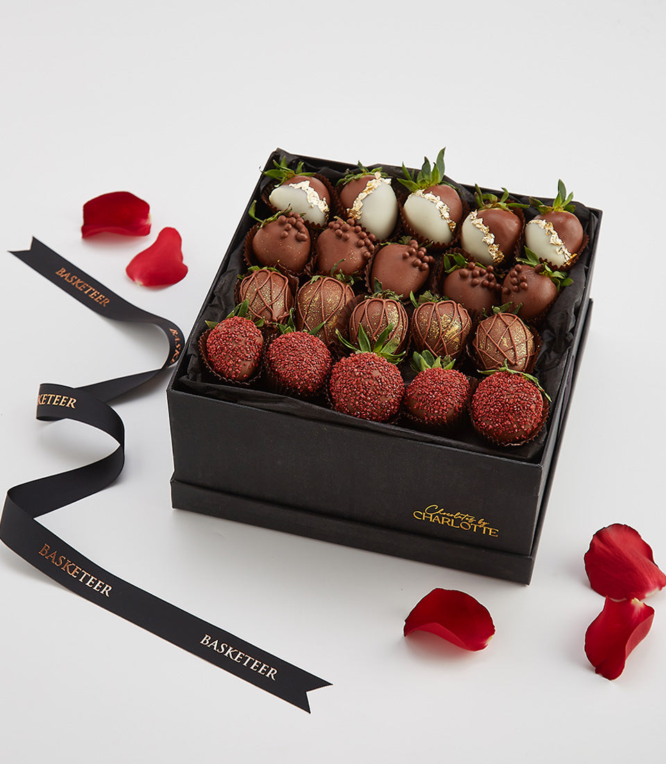 Luxury chocolate-covered strawberries gift box with white, milk chocolate, gold leaf, and red sprinkle varieties for