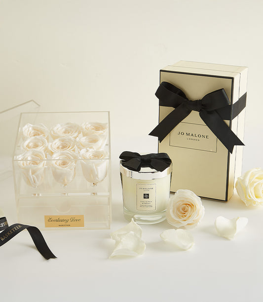 Luxury Valentine's gift set with nine preserved white roses, Jo Malone candle, and cream gift box with black ribbon