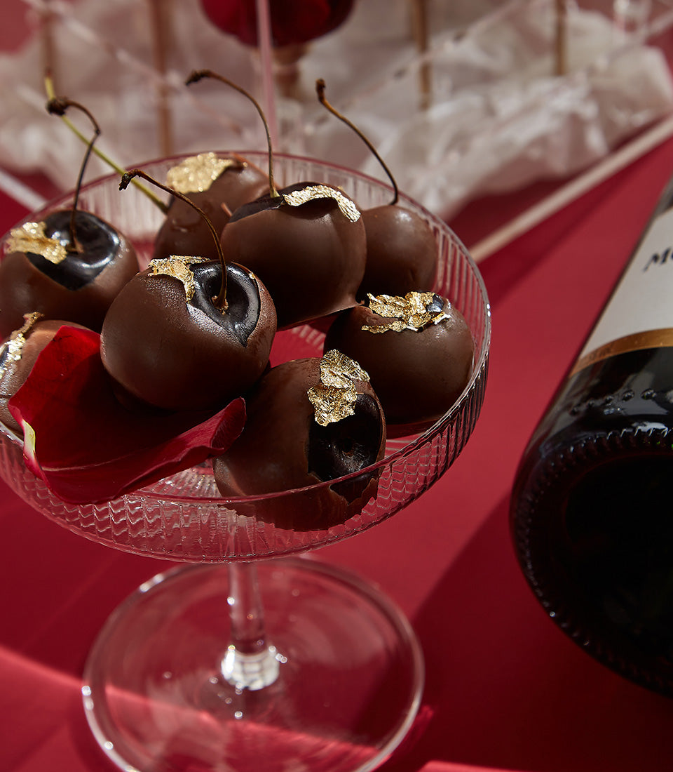 Luxury Valentine's champagne gift set with gold-leaf chocolate cherries and red rose petal