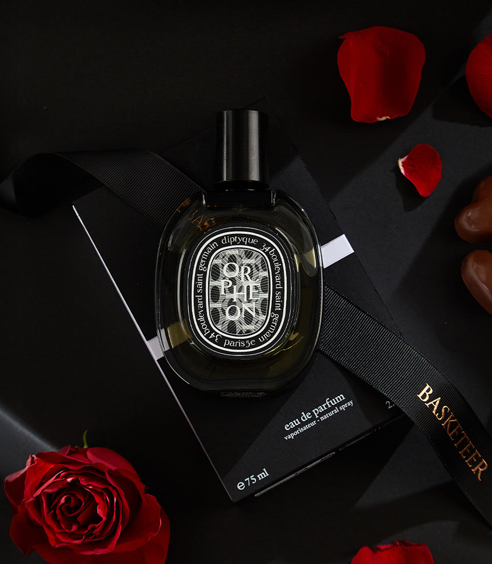 Luxury Valentine's gift set with Diptyque perfume, red roses, and heart chocolates