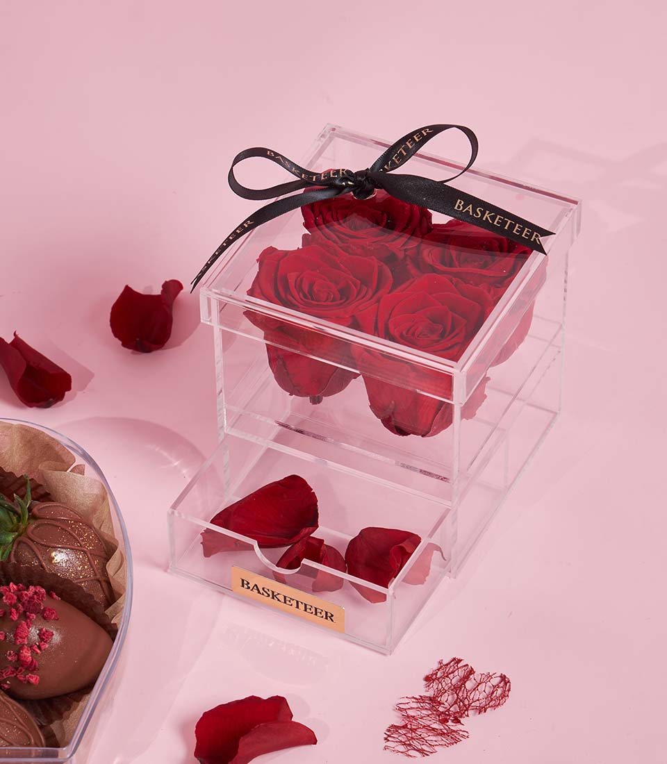 Charlotte Bakery gift set: chocolate-covered strawberries beside red preserved roses in a clear box. Order artisan cake Bangkok for a birthday delivery.