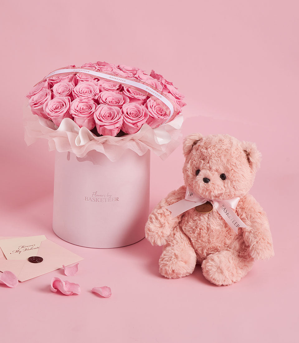 Sweet pink preserved rose flower box from Flowers by Basketeer, paired with a blush pink teddy bear. Perfect for flower delivery Bangkok.