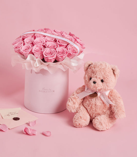 Sweet pink preserved rose flower box from Flowers by Basketeer, paired with a blush pink teddy bear. Perfect for flower delivery Bangkok.