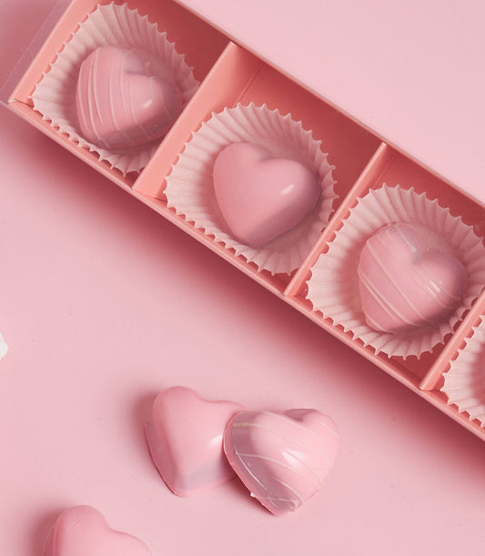 Pink raspberry passion bonbons Valentine chocolate gift set with white striped heart-shaped truffles in luxury box