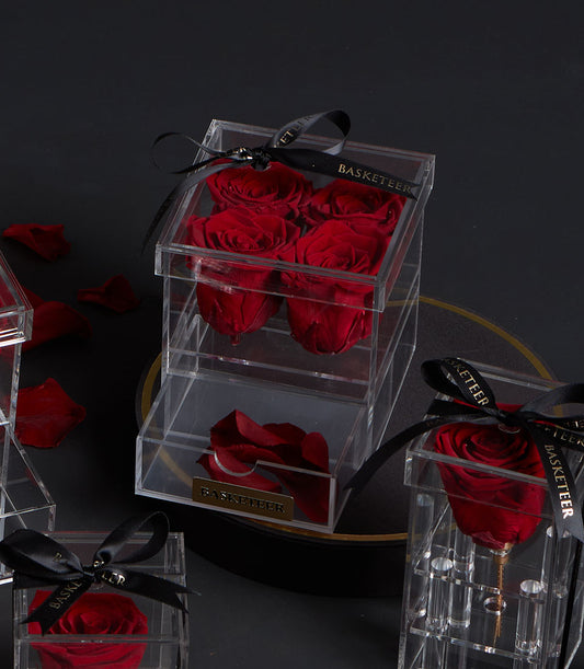 Elegant preserved red roses in clear acrylic boxes from Flowers by Basketeer. A luxurious rose bouquet for premium flower delivery Bangkok.