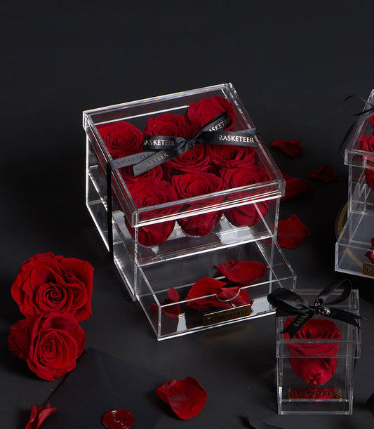 Luxury preserved red roses by Flowers by Basketeer in a modern acrylic gift box with a black ribbon. Perfect for same-day flower delivery Bangkok.