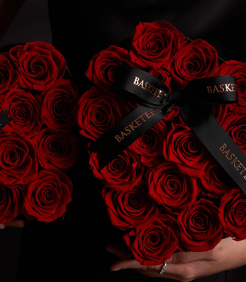 Deep red preserved rose heart boxes with black satin ribbons, luxury Valentine gift for couples