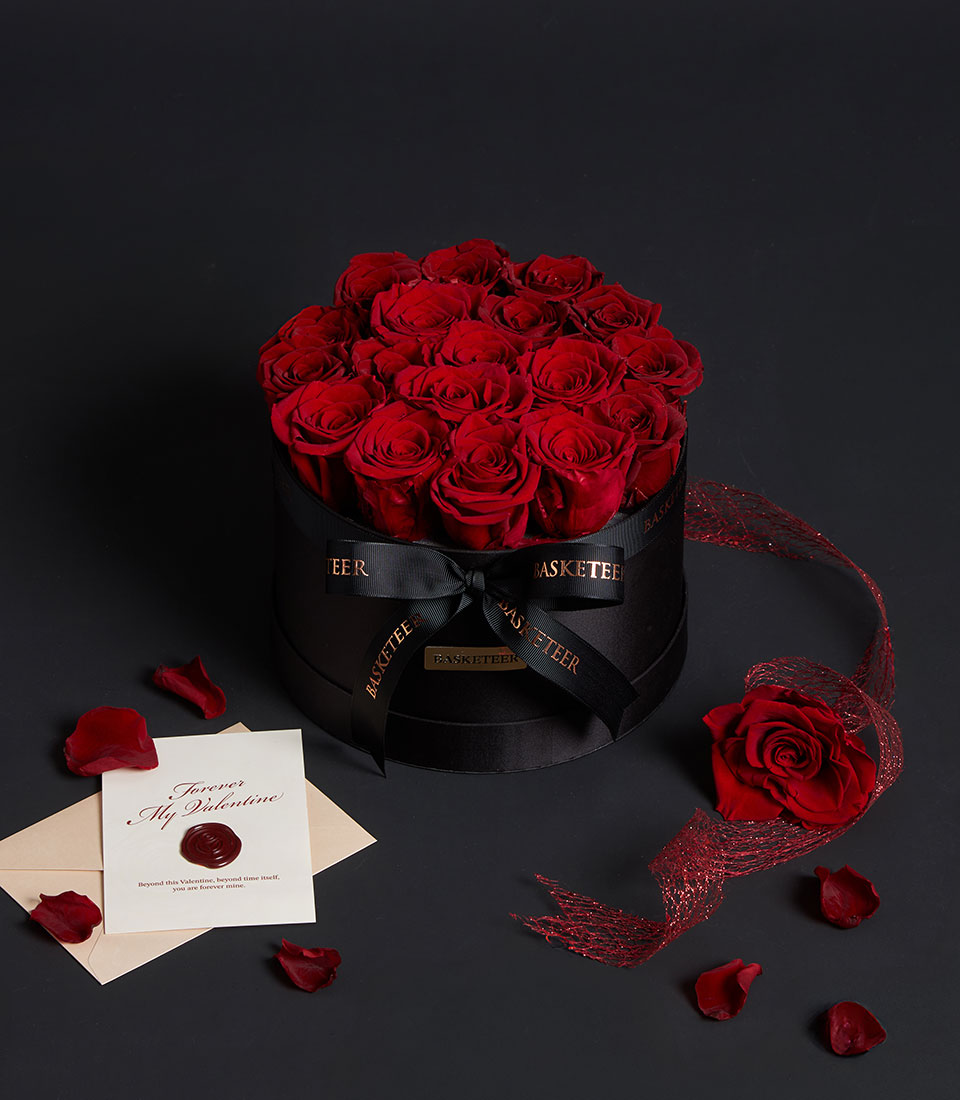 Luxe red rose arrangement from Flowers by Basketeer, beautifully displayed in a round black VIP box with ribbon. Perfect flower delivery Bangkok gift.