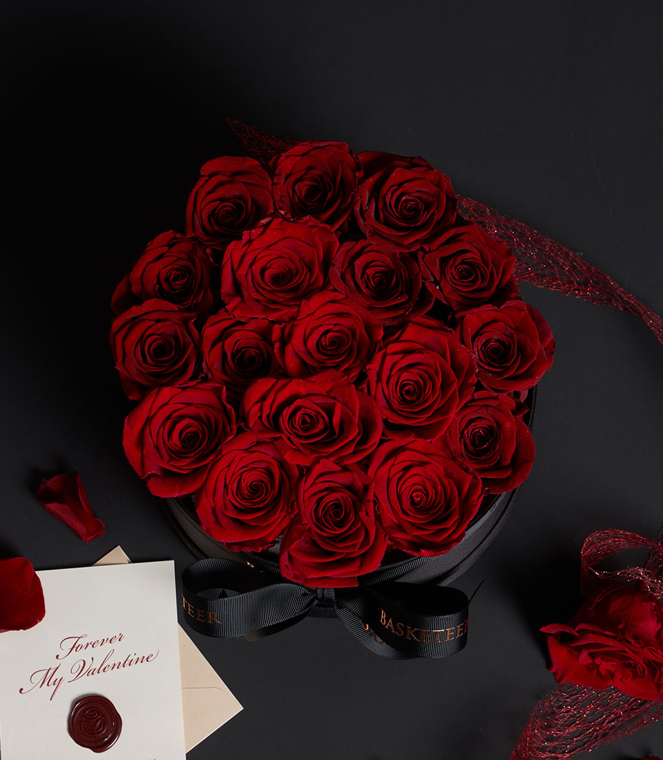 Luxury red preserved roses in black round hatbox with satin ribbon, Valentine's Day gift from Flowers by Basketeer